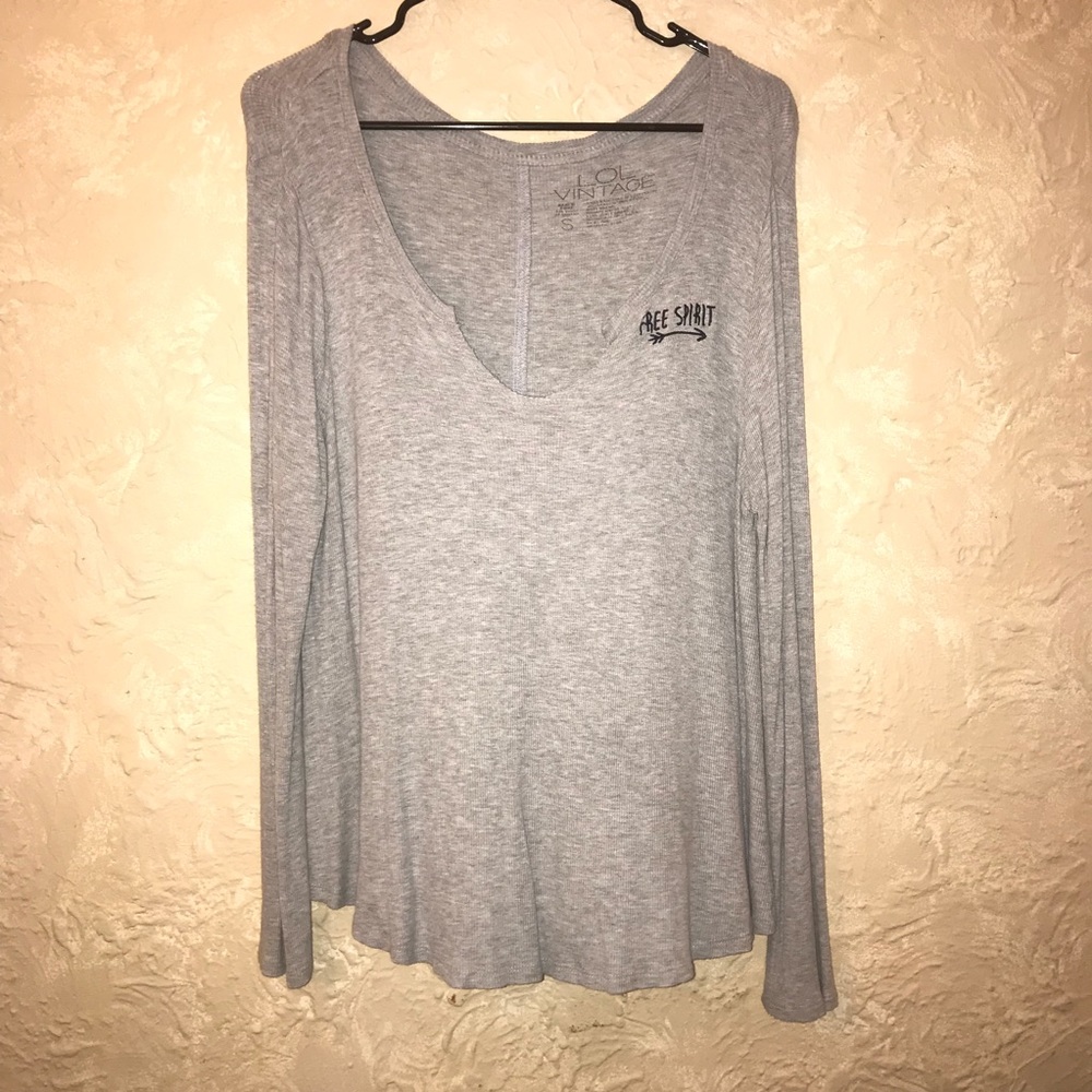 Grey shirt that says free spirit